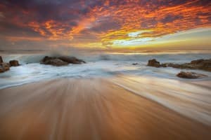 Ocean Waves at the Beach at Sunset Ministry Stock Photo