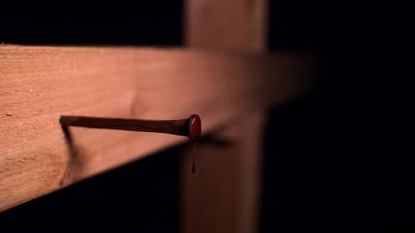 Christian Cross With Bloody Nail Stock Image