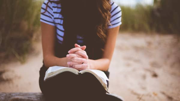 Girl Praying With Bible Religious Stock Photo