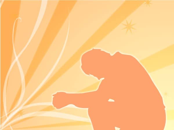 Man Praying in Orange Silhouette