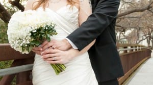 Bride and Groom Embracing Religious Stock Photo