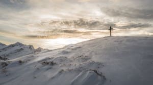 Cross on a Snowy Hill Christian Stock Photo