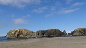Rock and Sand Beach Landscape Church Stock Photo