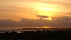 Beach Scene at Dusk Religious Stock Photo