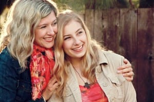 Mother and Daughter embracing Christian Stock Photos