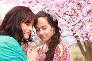 Hispanic Mother and Daughter Christian Stock Photo