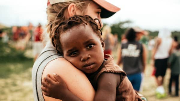 Christian Missionary Holding Child Religious Stock Photo