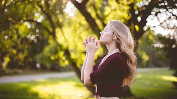 Woman Praying Outside Christian Stock Photo