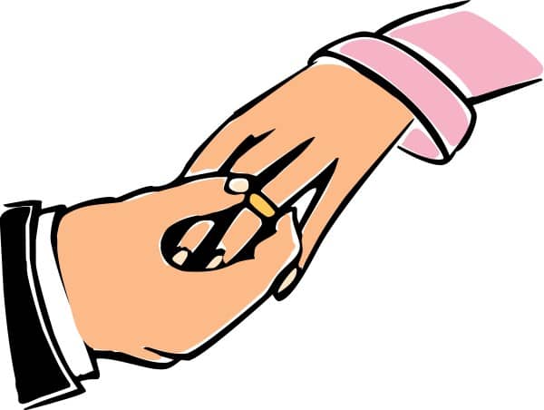 Groom Placing Ring